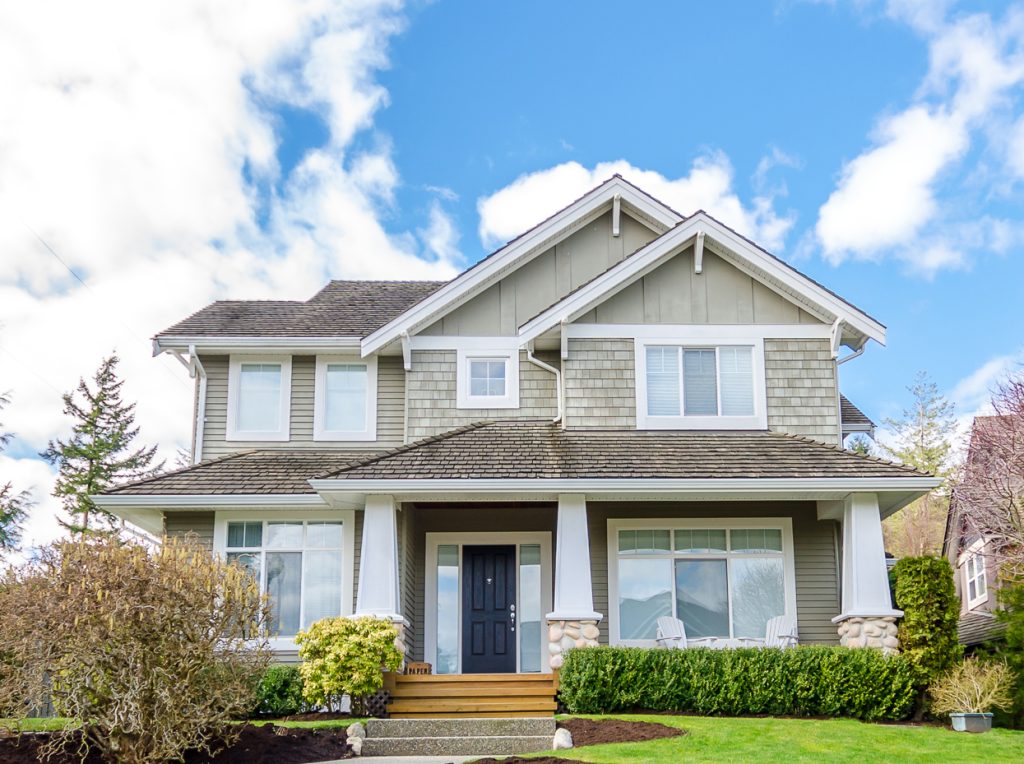 Luxury House With Beautiful Landscaping On A Sunny Day. Home Ext